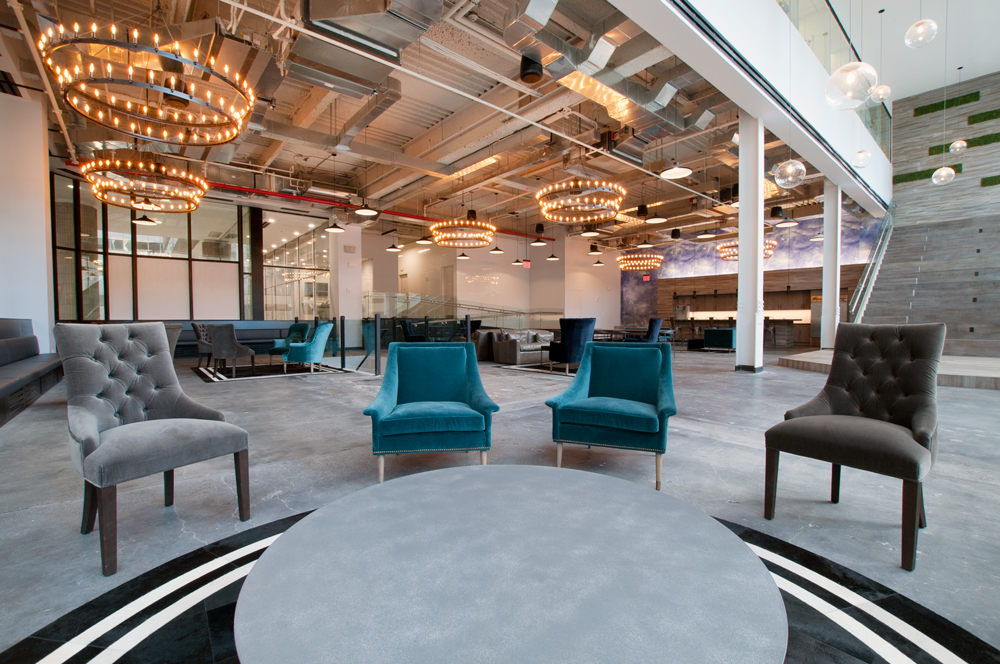 beautiful+startup+office+space+with+large+chandeliers+and+colorful+chairs.png